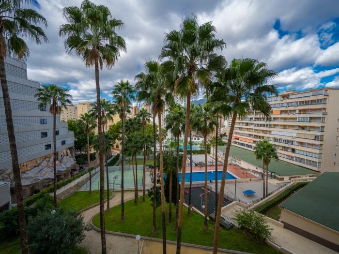 Mediterranean vegetation, soothing palm trees and sport facilities in urbanization